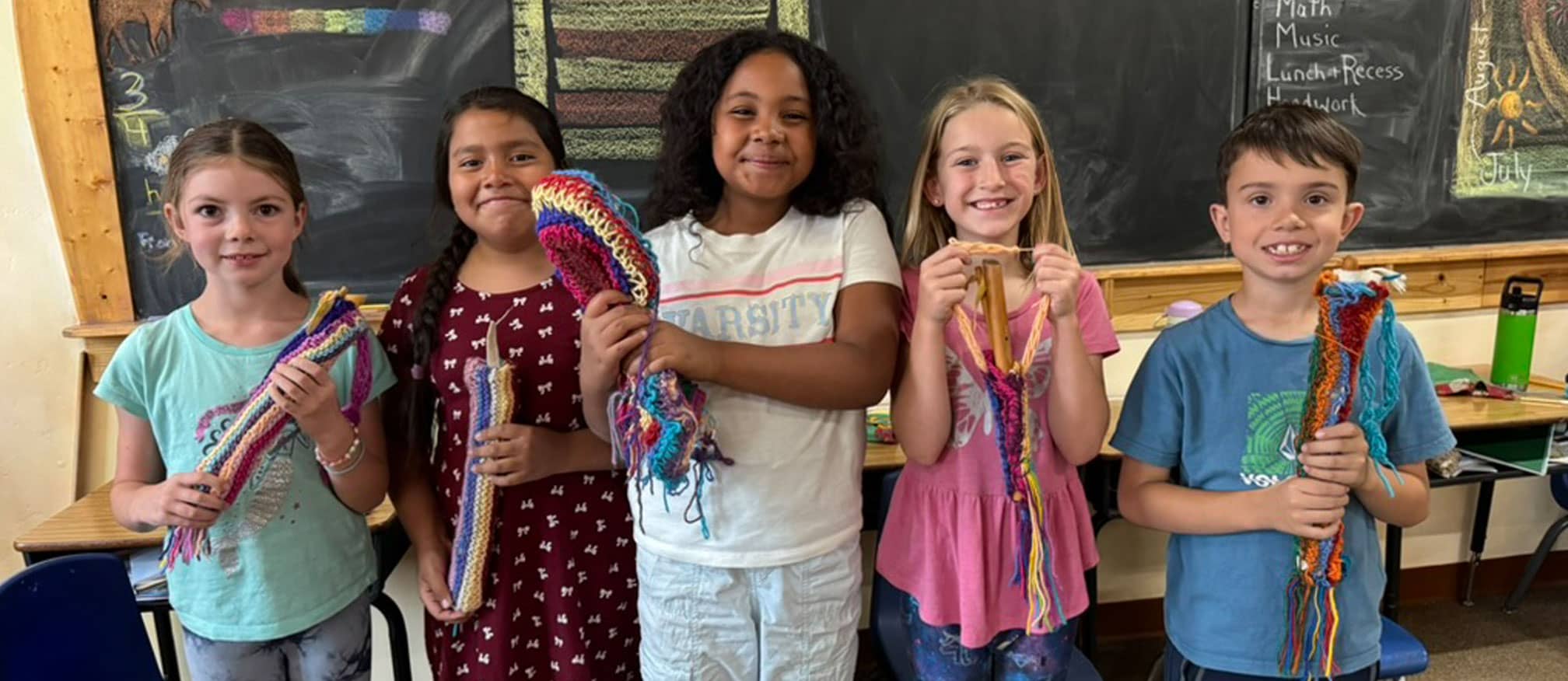 kids showing their crochet